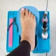 Pedicure table with adjustable footrest, fan and illuminated magnifier