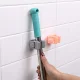 Self-adhesive wall holder for mop and broom, grey