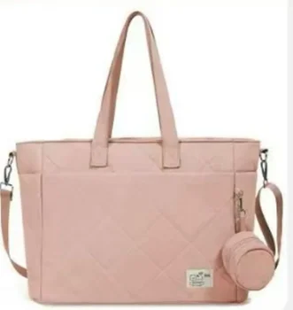 Pink quilted changing bag with shoulder strap and round pouch