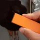 Cleaning eraser for glass and metal, orange