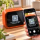 Smart desk clock with AI assistant and Bluetooth speaker, orange