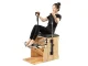Pilates exercise chair with adjustable pedals and resistance springs