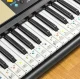 Stickers of notes on keys for learning to play