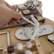 Kruzzel 22584 Educational Toy Wooden Manipulation Sensory Busy Board, Bear